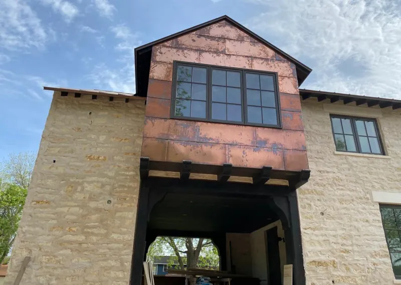 Copper metal panel facade on a stone building for Skylight Installation in Rye Brook