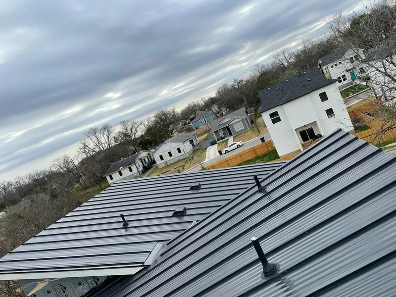Standing seam metal roof panels with vents for Skylight Repair in Rye Brook